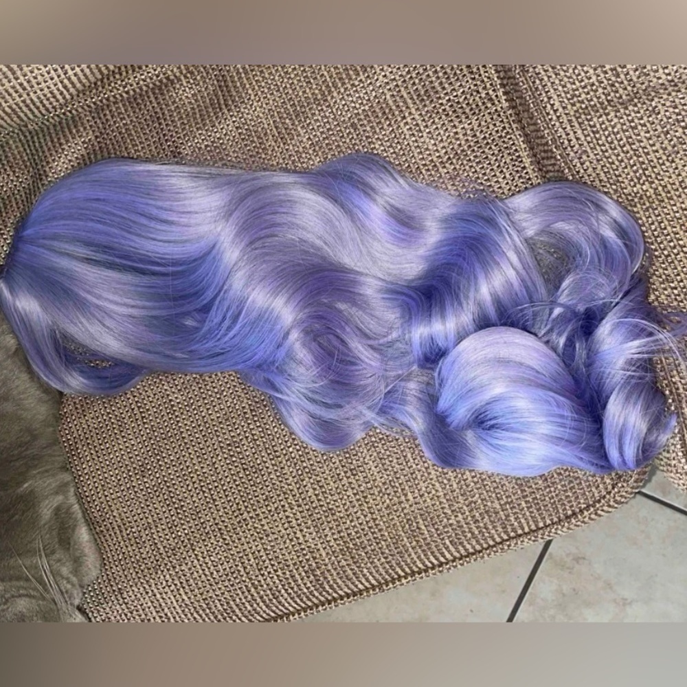 Long curly synthetic purple wig with bangs. good quality, never worn it.